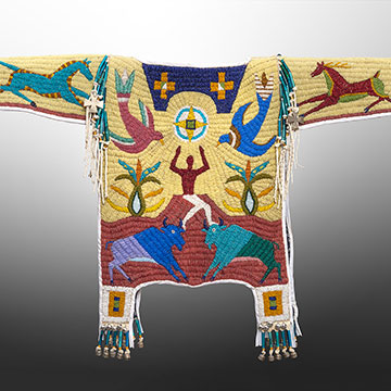 an intricately beaded shirt depicting horses, birds, buffalo and a central figure